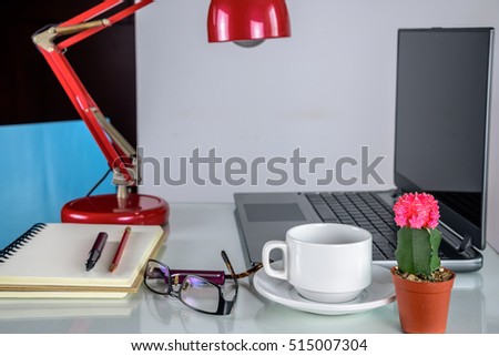Cactus pots, laptop & coffee cup  at home office / Interior landscape plants decoration for air pollution abatement concept