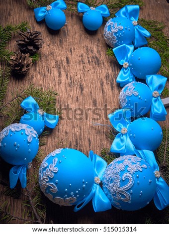 Blue Christmas balls on a wooden background, space for text,  Studio photography. Object shooting.