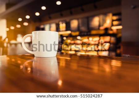 coffee cup in coffee shop - vintage style effect picture
