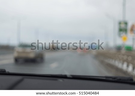 Blurred highway view through windshield, winter season