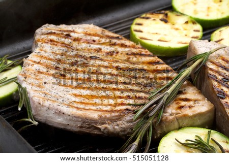 Grilled swordfish with rosemary and courgettes Royalty-Free Stock Photo #515051128