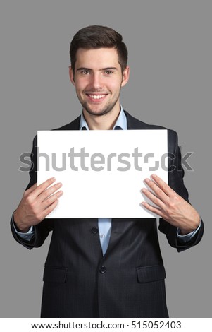 Portrait of a Man with a sign on a gray background
