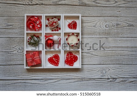 Christmas box decorations heart, Christmas balls, red ribbons and  candle. Vintage style colored picture. 