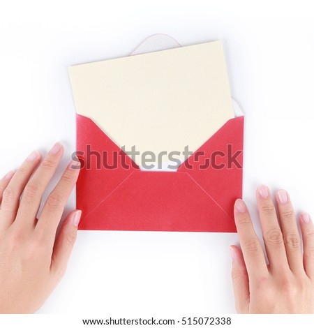 A female hand hold (open) a envelope and post card on white background 