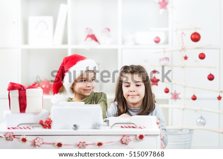 Two little kids are exited about their Christmas presents