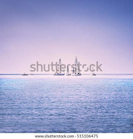 Sailing boat yacht or sailboat group regatta race on sea or ocean water. Panoramic view.