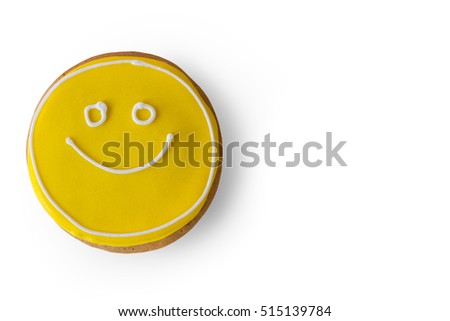 Smiley face cookie. Biscuit with yellow frosting. How to transfer good mood. Dessert that makes you smile.