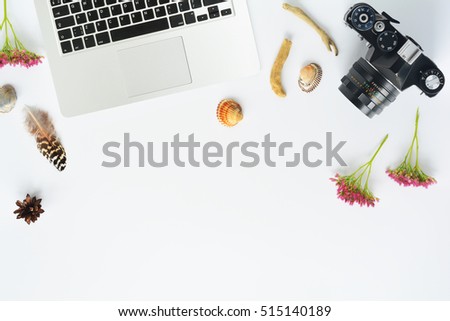 Natural elements with laptop and camera mock up on white background. Flat lay composition. Top view with place for art works, text, cartoons. Workplace of photographer, artist, naturalist, traveler