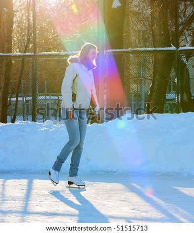 girl on winter skate rink