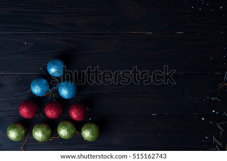 Christmas tree made of colorful balls on a black background. Space for text