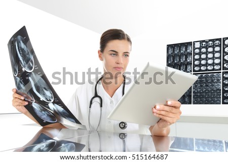 Radiologist woman checking x ray, with tablet, medical and radiology concept