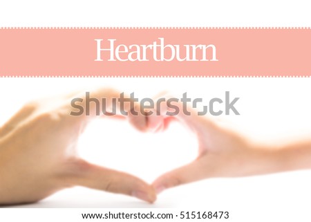 Heartburn - Heart shape to represent medical care as concept. The word Heartburn is a part of medical vocabulary in stock photo.