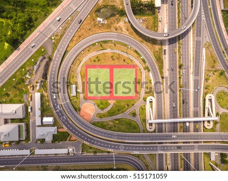 Top view over the road and highway, Aerial shot of highway interchange of a city, Shot from drone