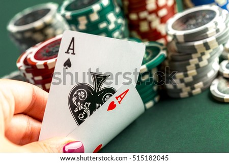 Cards and chips for poker on green table Royalty-Free Stock Photo #515182045