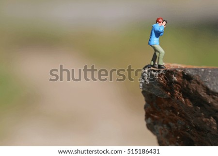 Photographer standing on the edge.