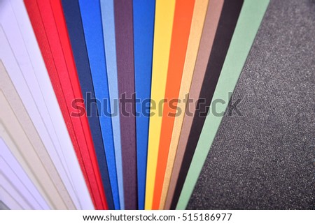 colored paper on a black background
