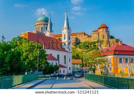 Narrow street in the hungarian city Esztergom with the church of saint Ignac and basilica on top of the hill.