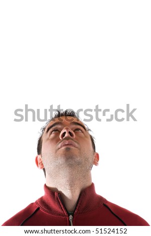 A young man isolated over white looking at the weather or something above.  Plenty of copyspace to add your own object or text above.