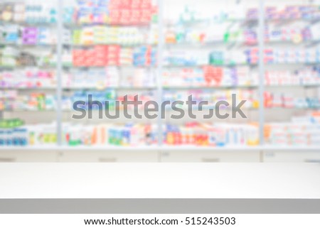 counter store table pharmacy background shelf blurred blur focus drug medical shop drugstore medication blank medicine pharmaceutics concept - stock image