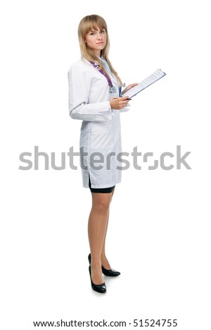 young attractive female doctor is standing with the clipboard and looking in the camera Royalty-Free Stock Photo #51524755