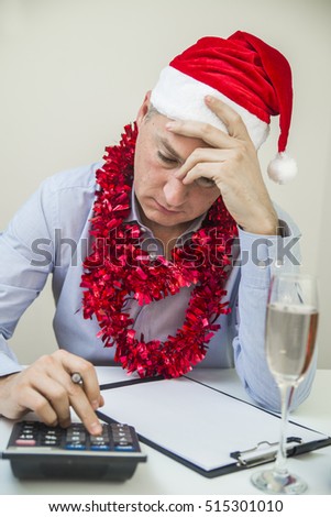 Business Man Celebrate Merry Christmas And Happy New Year Wear Santa Hat. Portrait Of A Businessman Calculating Finance In Office