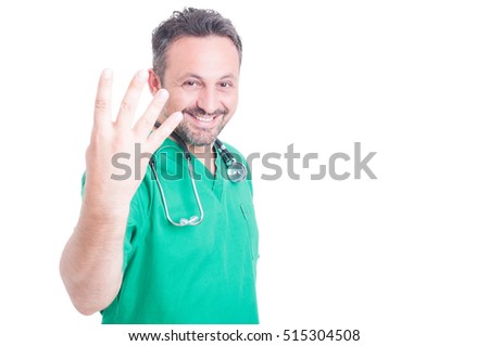 Smiling man doctor in medical unifrom counting four fingers isolated on white with advertising area