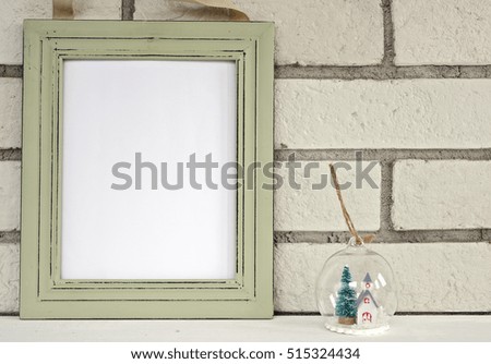Christmas and New Year background. Empty picture frame, fir and snow ball decoration with with copy space blank tag on white background. Copy space image. Scandinavian style home interior decoration