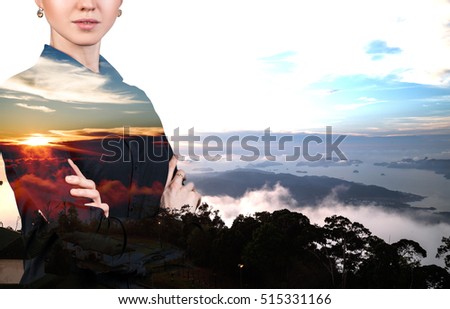Double exposure of businessman and sunset.
