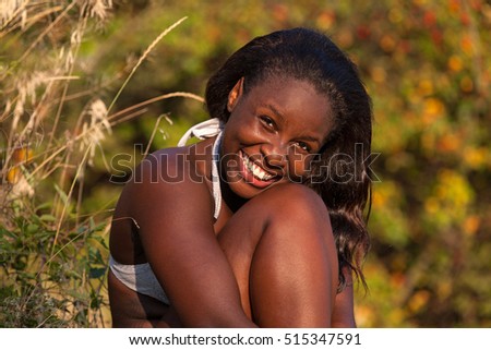 Closeup of a smiling black girl outdoor