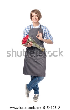 smiling attractive woman professional florist with bunches of rose flowers showing an okay sign isolated on white background. floristry and business concept. service promotion. advertisement gesture