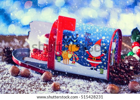 Snow Falling On Christmas Letter In Mailbox Decorated With Santa Claus And Reindeer. Selective Focus. Vintage Filter Applied.