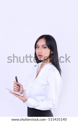 Charming beautiful tan skin Asian woman hand use tablet and pen. Confident woman manager concept presenting your product. Isolated on grey background.