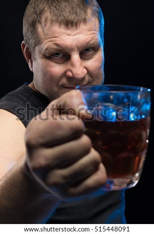 Brutal male actor with a glass of beer on a black background.
Caricature change.