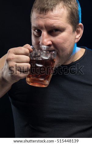 Brutal male actor with a glass of beer on a black background.
Caricature change.