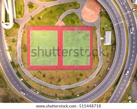 Top view over outdoor sports court, Aerial view over the road and highway, Shot from drone