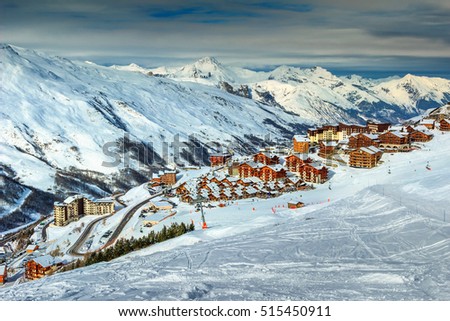 Stunning winter landscape and ski resort with typical alpine wooden houses in French Alps,Les Menuires,3 Vallees,France,Europe Royalty-Free Stock Photo #515450911