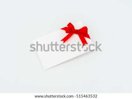 Card with red ribbons bows
