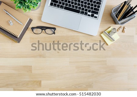 Office desk table with laptop, supplies and tablet . Top view with copy space Royalty-Free Stock Photo #515482030