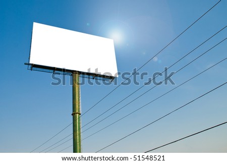 huge white blank billboard with blue sky and cables with sun