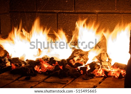 Charcoal Barbecue in Flames at Night