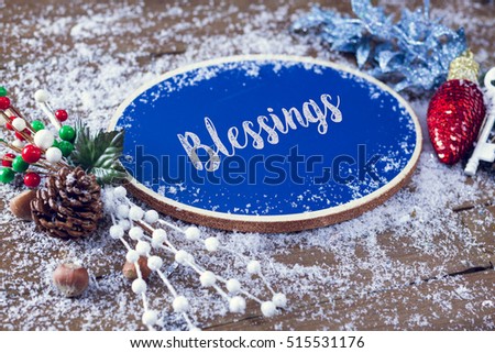 Blessings Written In Chalk On Blue Chalkboard Holiday Sign Background With Snow And Decorations.