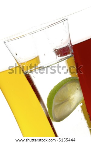 glasses with juice and lime on the white background