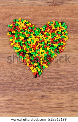 Colored candy lined heart. Declaration of love on the day of St. Valetina.