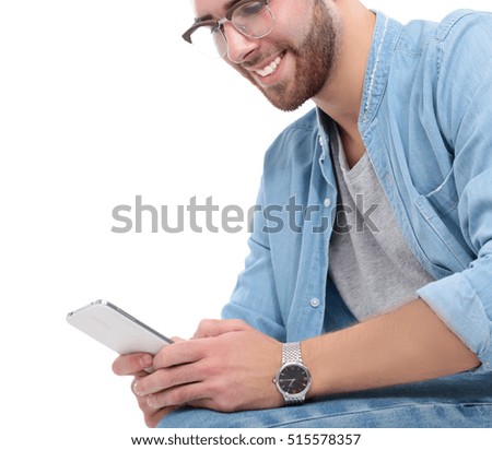Handsome tourist looking at map isolated on white