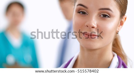 Portrait of woman doctor standing in the hospital
