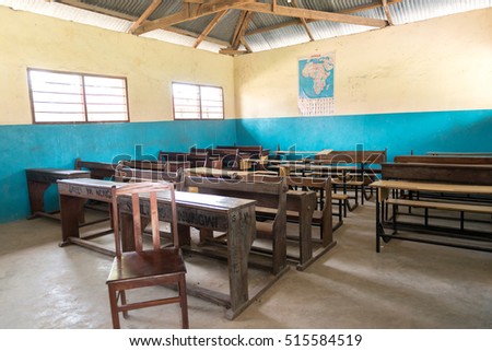 simple class room in village school with wooden desks and chairs in Zanzibar, Africa