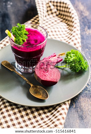 Detox smoothie drink of organic beet vegetable on rustic wooden table
