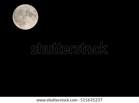Super moon in the upper left corner. Copy space. Moon composed to the left upper corner. Black sky