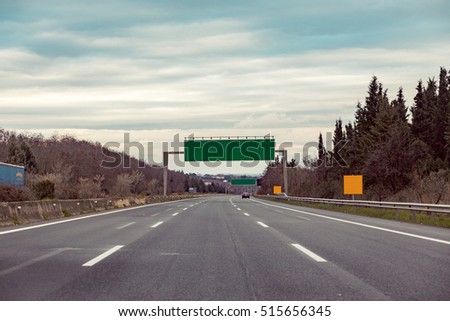 Blank road destination sign on motorway. Add your own text