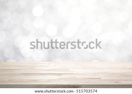 Wood table top on  abstract white bokeh, Christmas and festive theme background
